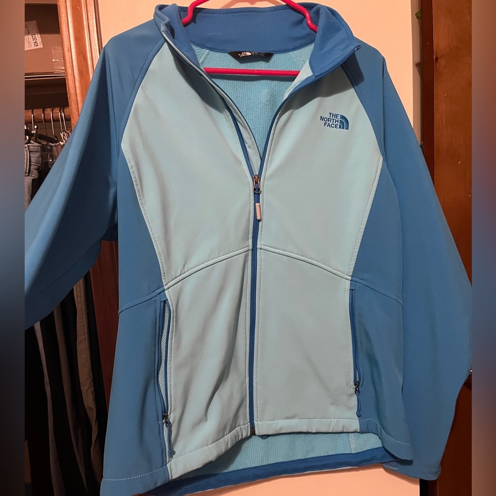 The North Face Blue Two-tone Soft Shell fleece lined jacket.